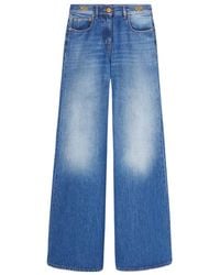 Versace - Medusa 95 Logo-Engraved Mid-Rise Flared Jeans - Lyst