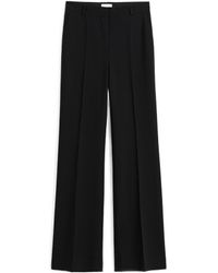 TOTEME - Totême Pressed Creased Flared Leg Trousers - Lyst