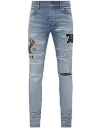 Amiri - Logo-Appliqué Skinny Jeans - Lyst