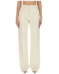 Valentino - All-Over Logo Patterned Straight Leg Pants - Lyst