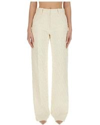 Valentino - All-Over Logo Patterned Straight Leg Pants - Lyst