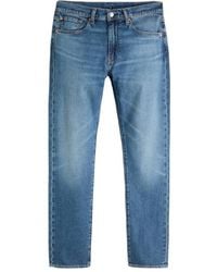 Levi's - Logo Patch Tapered-Leg Jeans - Lyst