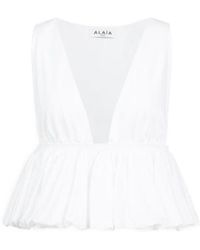 Alaïa - Alaïa Openwork Peplum Top - Lyst