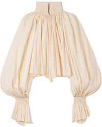 KHAITE - Durer Smocked Puff-Sleeve Crop Top - Lyst