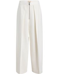 KHAITE - Marine Low-Rise Wide-Leg Pants - Lyst