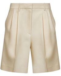 KHAITE - Pleated Knee-Length Shorts - Lyst