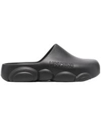 Moschino - Logo Embossed Slip-On Mules - Lyst