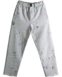 Vetements - Scribble-Print Raw-Edge Track Pants - Lyst