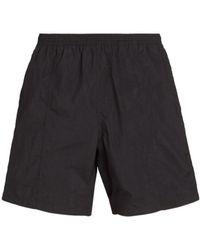 Ami Paris - Ami Logo Embossed Elastic Waistband Swim Shorts - Lyst