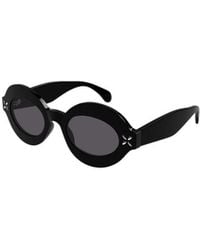Alaïa - Alaïa Oval Studded Frame Sunglasses - Lyst