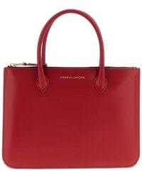 Comme des Garçons - Comme Des Garçons Wallet Logo Printed Handbag - Lyst
