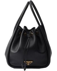 Prada - Logo Plaque Drawstring Bucket Bag - Lyst