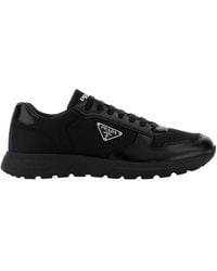 Prada - Logo Plaque Low-Top Sneakers - Lyst