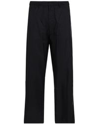 Prada - Logo Plaque Straight Leg Trousers - Lyst