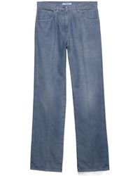 Prada - Logo-Patch Denim Jeans - Lyst