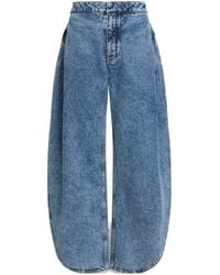 Alaïa - Side-Split Petal Round Jeans - Lyst