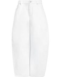 Alaïa - Alaïa Rodeo Curved-Leg Jeans - Lyst