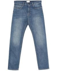 Versace - Logo-Patch Denim Jeans - Lyst