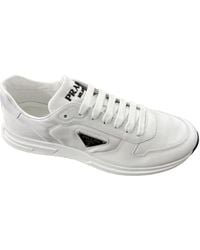 Prada - Logo Plaque Low-Top Sneakers - Lyst