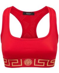 Versace - Greca Logo Stretch Tech Sports Bra - Lyst