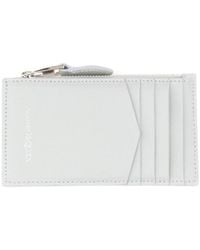 McQueen - Skull Stud Zipped Wallet - Lyst