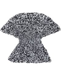 KHAITE - Mathilde Hand-Knit Peplum Top - Lyst