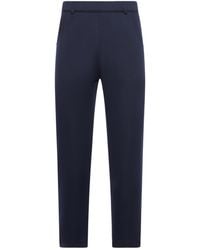 Prada - Logo Detailed Tapered Leg Trousers - Lyst