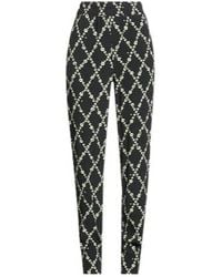 Ganni - High-Waisted Floral Printed Tapered Pants - Lyst