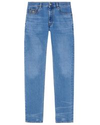Versace - Logo-Patch Denim Jeans - Lyst