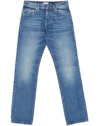 Versace - Logo-Patch Denim Jeans - Lyst