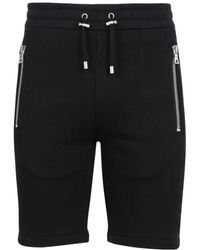 Balmain - Logo Embossed Bermuda Shorts - Lyst