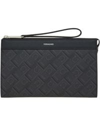 Ferragamo - Ferragamo Monogram Printed Zipped Wristlet Bag - Lyst