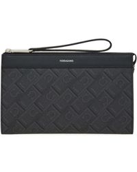 Ferragamo - Ferragamo Monogram Printed Zipped Wristlet Bag - Lyst