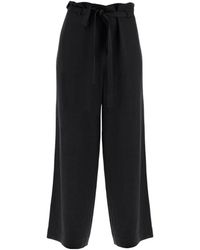 TOTEME - Totême Belted Flared Trousers - Lyst