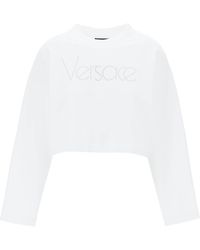 Versace - Felpa Cropped Con Logo In Strass - Lyst