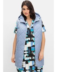 Sheego - Lange Steppweste mit Kapuze und Kontrastdetails - Lyst