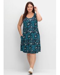 Sheego - Jerseykleid mit Blätterprint und Taschen - Lyst