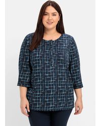 Sheego - Tunika mit 3/4-Arm und grafischem Alloverprint - Lyst