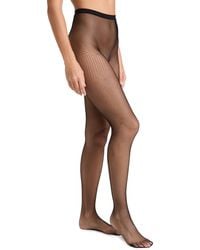 Stems - Micro Fishnet Tights - Lyst