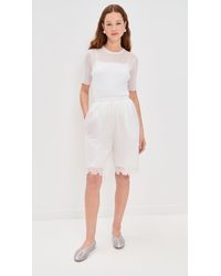 Cecilie Bahnsen Arya Nylon Bermuda Shorts in White | Lyst
