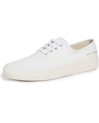 Common Projects - Four Hole Slip On Sneakers - Lyst