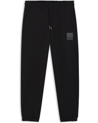 HUGO - Cotton-Terry Tracksuit Bottoms With Split Logo - Lyst