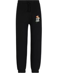 HUGO - Relaxed-Fit Tracksuit Bottoms With Floral Logo Artwork - Lyst