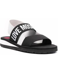 Love Moschino - 's Logo Print Strap Sandals - Lyst