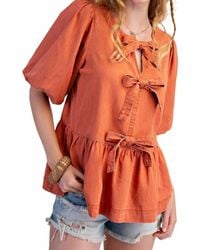 Easel - Bow Front Denim Peplum Blouse - Lyst