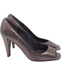 Stuart Weitzman - Snakeskin Peep-Toe Pumps - Lyst