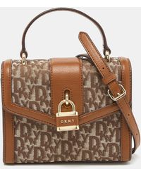 DKNY - /brown Signature Canvas And Leather Padlock Charm Top Handle Bag - Lyst