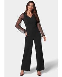 Bebe - V-Neck Jumpsuit With Powermesh Sleeve - Lyst