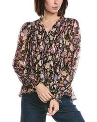 Cece - Smocked Bodice & Cuff Peplum Top - Lyst
