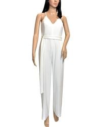 Bebe - Back Lace Belted V-Neck Jumpsuit - Lyst